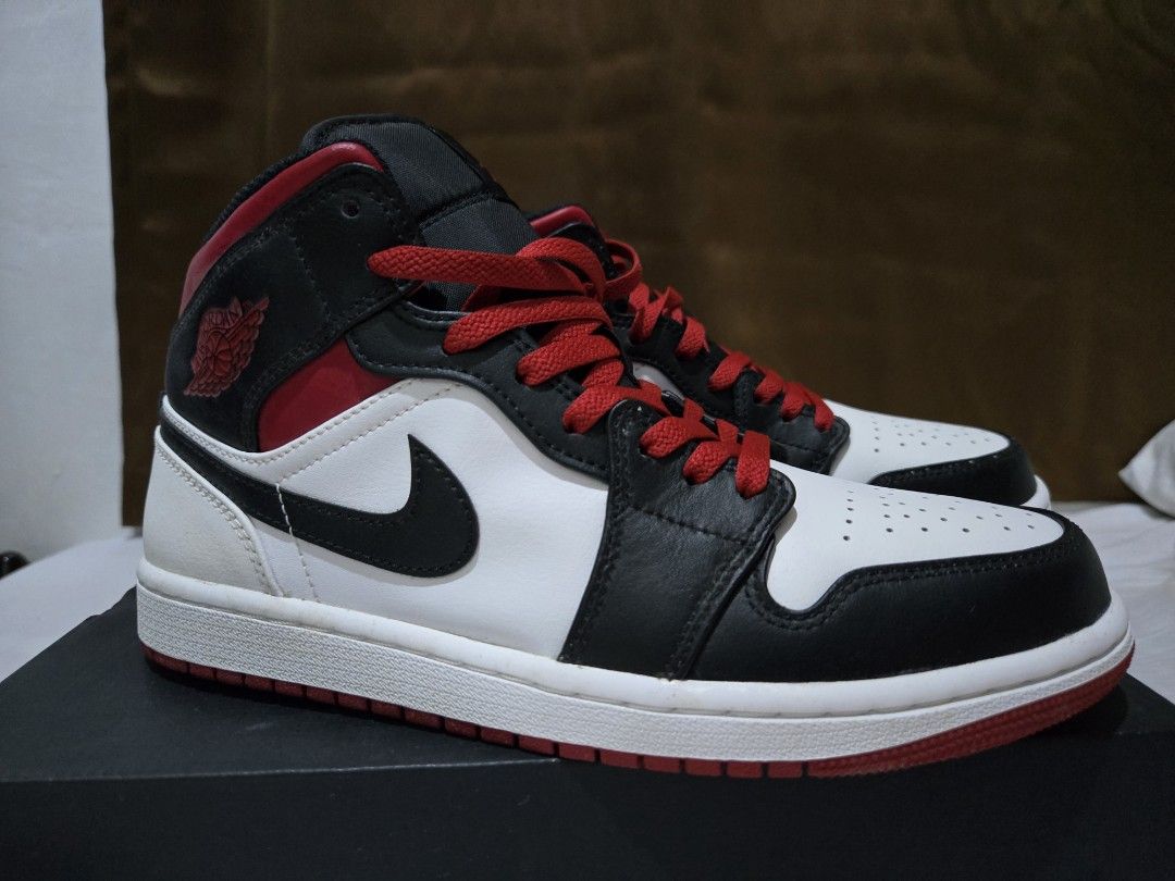 Air Jordan 1 Mid Red Black White (Category: Sneakers) located in Naic. Submitted by ad_hi_def (Listing ID 1464896569, Image 2). Description: RFS: not my exact size No reservations, first to pay basis Strictly no meetups Authentic, bought in Dubai (no receipt but will try to find).