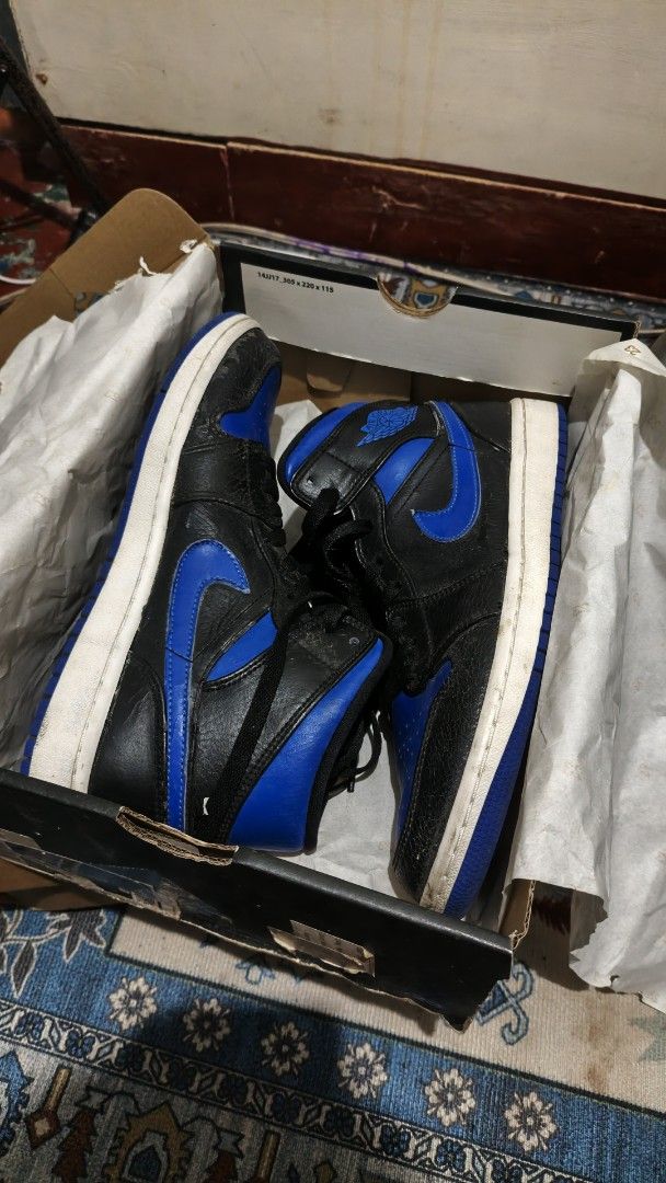 Air Jordan 1 Mid Royal Blue Black (Category: Sneakers) located in Manila. Submitted by zy0420 (Listing ID 1464877554, Image 3). Description: - Model: Air Jordan 1 Mid (Black and Royal Blue) - Material: Premium tumbled leather upper with contrast blue toe box - Condition: leather starting crack, minor wear on sole edges - Inclusion: Original black Jordan box included - Mode of Payment: GCash or BPI - Shipping: MOP via J&T (Buyer shoulders fee) / M