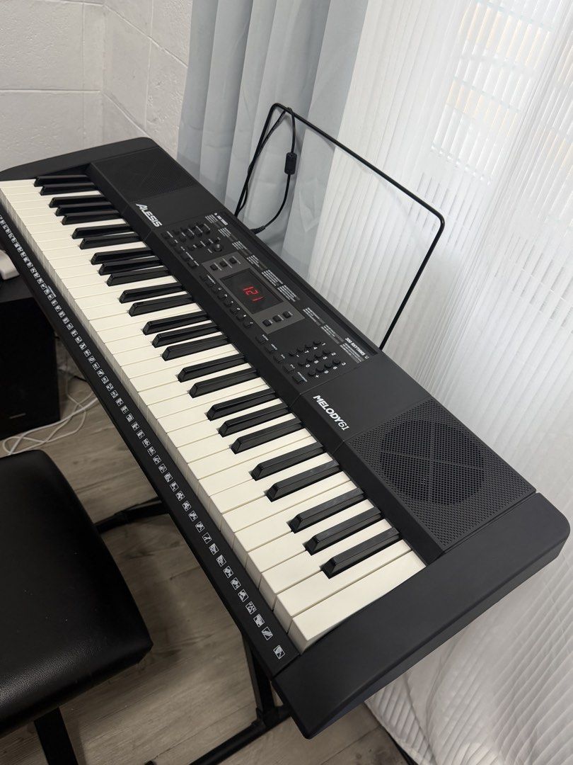 Alesis Melody 61 Keyboard with Stand and Bench (Category: Musical Instruments) located in Manila. Submitted by bertomax (Listing ID 1464857409, Image 3). Description: - Alesis Melody 61 keyboard with built-in speakers and digital display - Features multiple built-in tones and rhythms - Includes sturdy X-frame stand - Includes sheet music rest - Includes comfortable padded black bench - Everything pictured is included as a complete set - Ready for