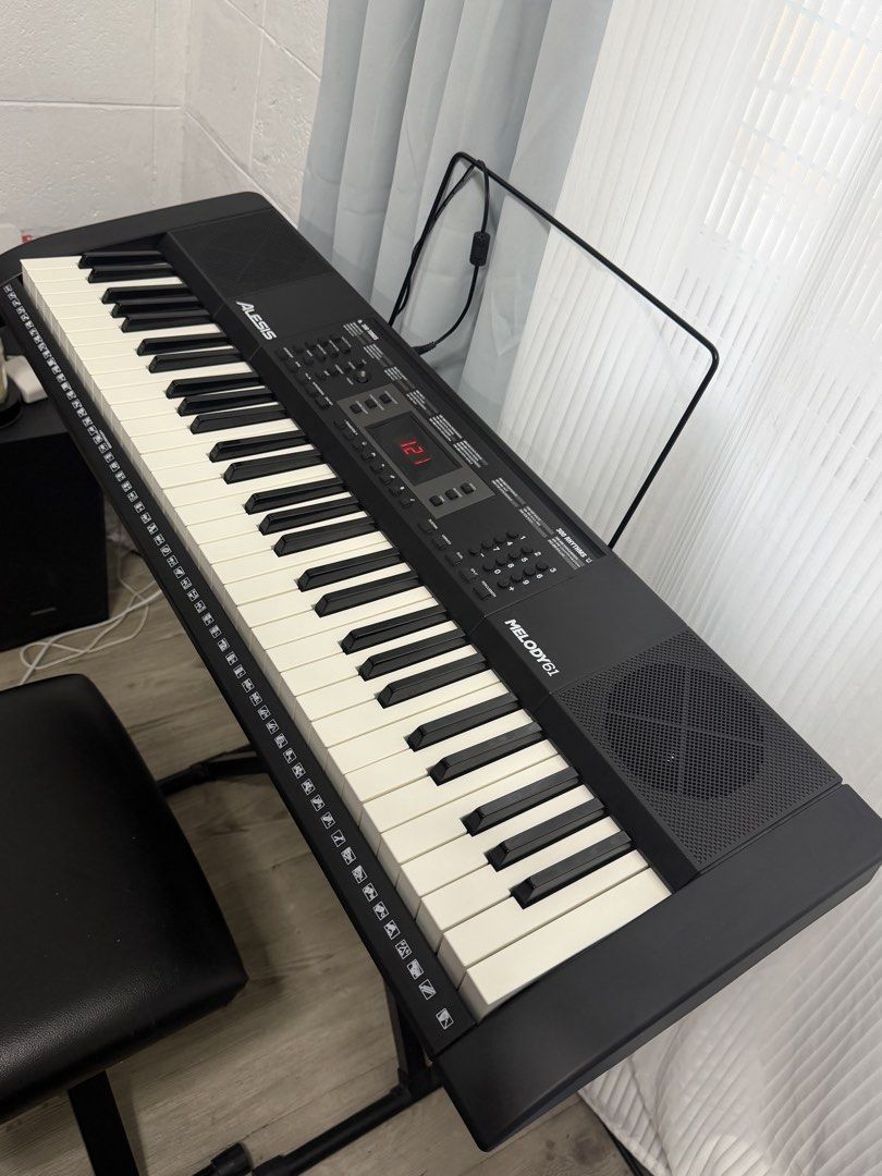 Alesis Melody 61 Keyboard with Stand and Bench (Category: Musical Instruments) located in Manila. Submitted by bertomax (Listing ID 1464857409, Image 2). Description: - Alesis Melody 61 keyboard with built-in speakers and digital display - Features multiple built-in tones and rhythms - Includes sturdy X-frame stand - Includes sheet music rest - Includes comfortable padded black bench - Everything pictured is included as a complete set - Ready for