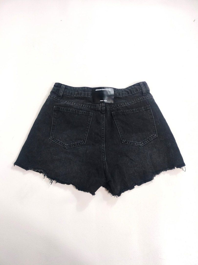 Alexander Wang black denim shorts (Category: Shorts) located in Manila. Submitted by naphthrift (Listing ID 1464854799, Image 3). Description: alexander wang y2k Denim Sexyshort Condition: Excellent Wash Size : 28 Actual 👇 Waist : 28 Lenght : 13 Insem : 9 📌 - Brand: Alexander Wang - Color: Washed black with vintage effect - Fit: High-waisted - Details: Raw hem, classic five-pocket design, belt loops - Branding: Signature leather patch on back w