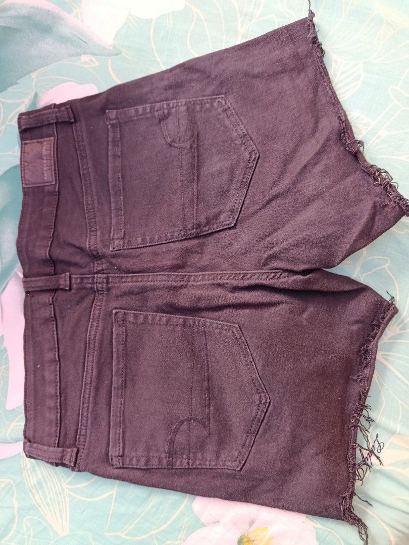 American Eagle Black Denim Cutoff Shorts (Category: Shorts) located in Manila. Submitted by jzministore (Listing ID 1464782705, Image 2). Description: - Brand: American Eagle - Color: Classic Black - Style: Denim shorts with raw frayed hem - Fit: Sturdy fabric with slight stretch - Details: 5-pocket styling, zip fly, button closure, and signature back pocket stitching - Condition: Great basic for everyday wear.