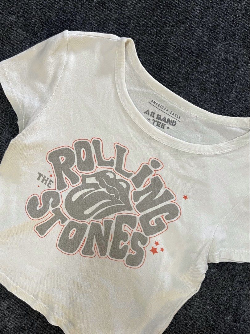 American Eagle Rolling Stones Band Tee Crop Top (Category: Shirts) located in Los Banos. Submitted by reworn.clo2026 (Listing ID 1464904039, Image 2). Description: Best fit: Small * Width: 16 * Length: 16.5 * Good condition * Color rate: 9/10 * See last pic for reference .