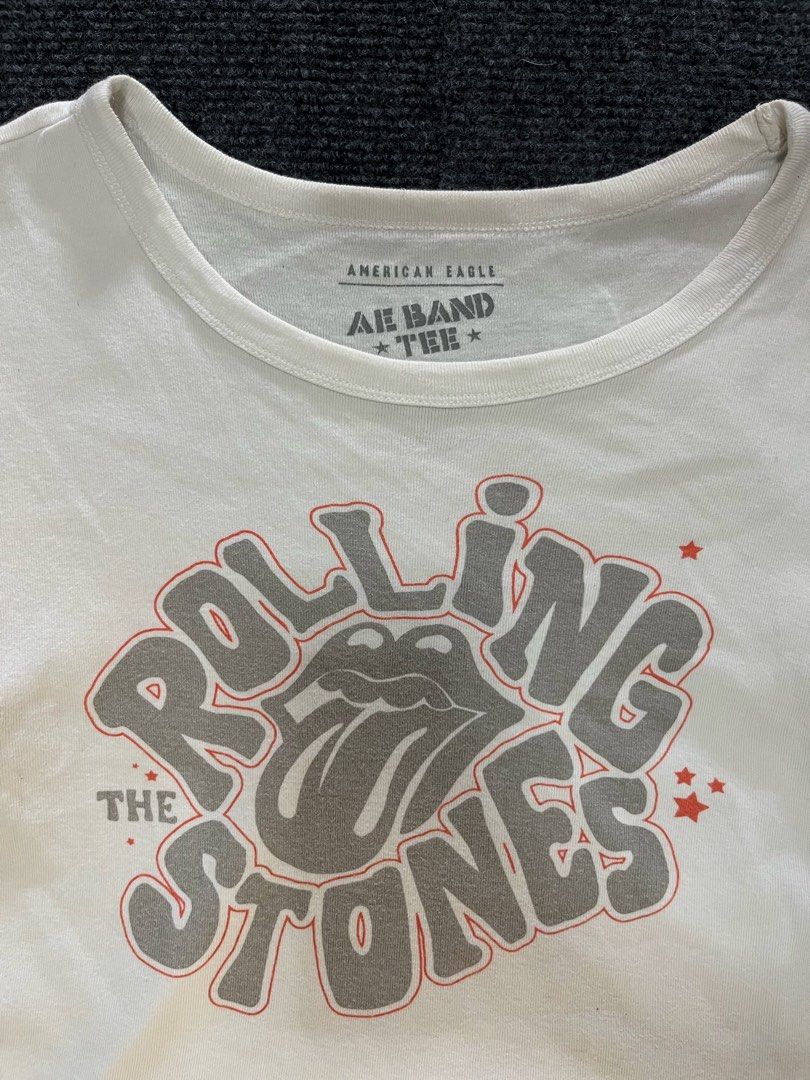 American Eagle Rolling Stones Band Tee Crop Top (Category: Shirts) located in Los Banos. Submitted by reworn.clo2026 (Listing ID 1464904039, Image 3). Description: Best fit: Small * Width: 16 * Length: 16.5 * Good condition * Color rate: 9/10 * See last pic for reference .