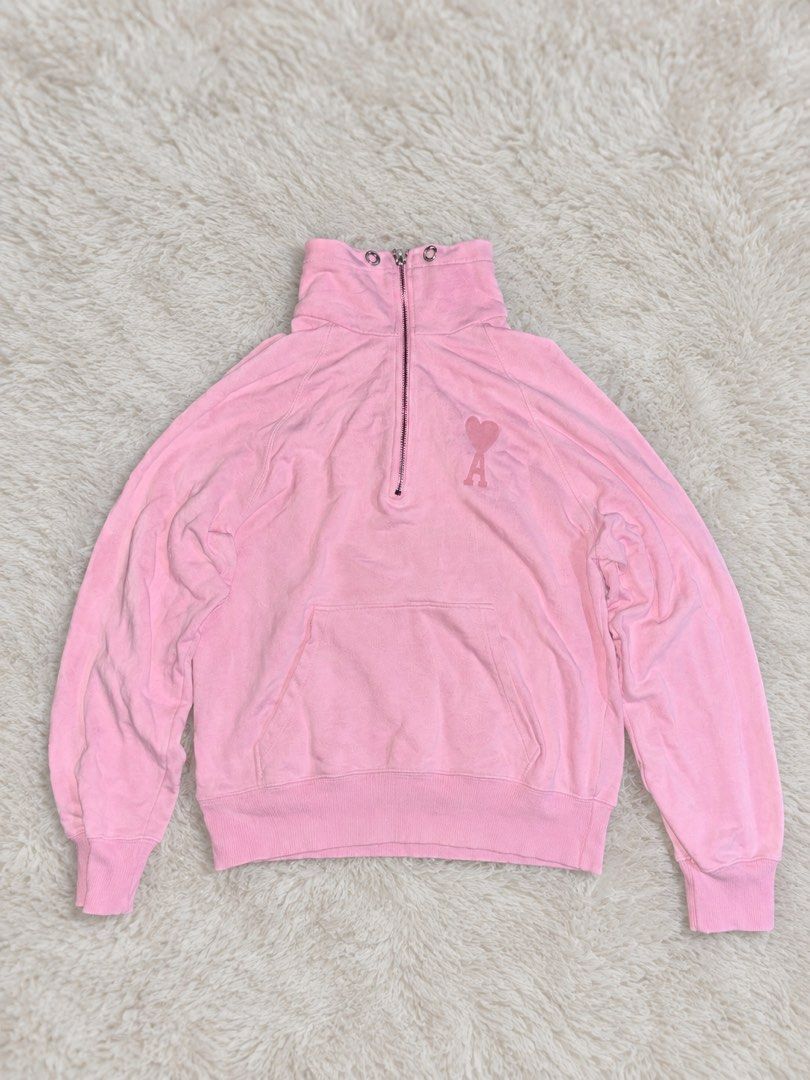 Ami Paris Pink Half Zip Sweatshirt (Category: Coats, Jackets and Outerwear) located in Rizal. Submitted by robert015 (Listing ID 1464899984, Image 1). Description: - Brand: Ami Paris - Style: Half-zip sweatshirt with high funnel neck and double grommet details - Color: Soft pink Size: Medium Issue: May butas may dumi den need wash 7/10 condition Location taytay.