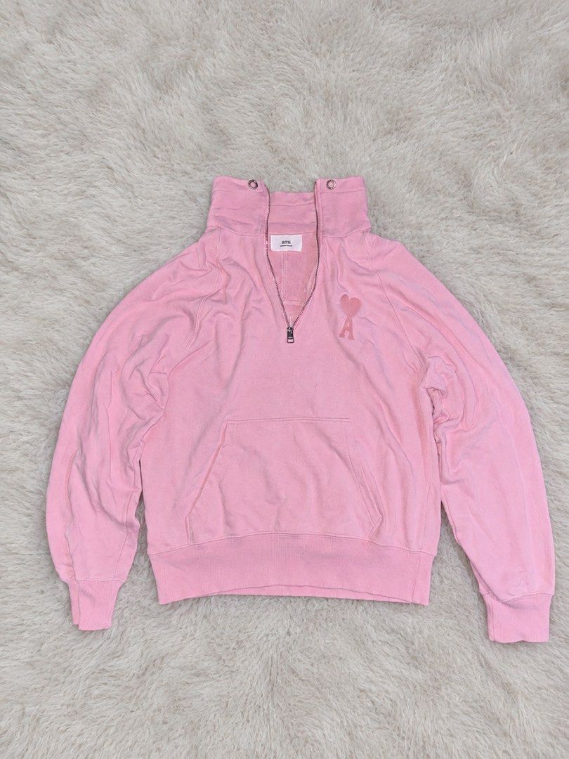 Ami Paris Pink Half Zip Sweatshirt (Category: Coats, Jackets and Outerwear) located in Rizal. Submitted by robert015 (Listing ID 1464899984, Image 2). Description: - Brand: Ami Paris - Style: Half-zip sweatshirt with high funnel neck and double grommet details - Color: Soft pink Size: Medium Issue: May butas may dumi den need wash 7/10 condition Location taytay.