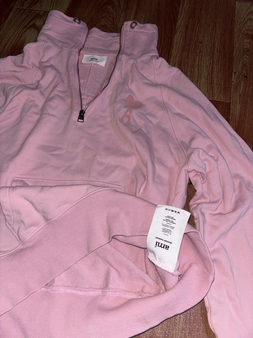Ami Paris Pink Half Zip Sweatshirt (Category: Coats, Jackets and Outerwear) located in Rizal. Submitted by robert015 (Listing ID 1464899984, Image 3). Description: - Brand: Ami Paris - Style: Half-zip sweatshirt with high funnel neck and double grommet details - Color: Soft pink Size: Medium Issue: May butas may dumi den need wash 7/10 condition Location taytay.