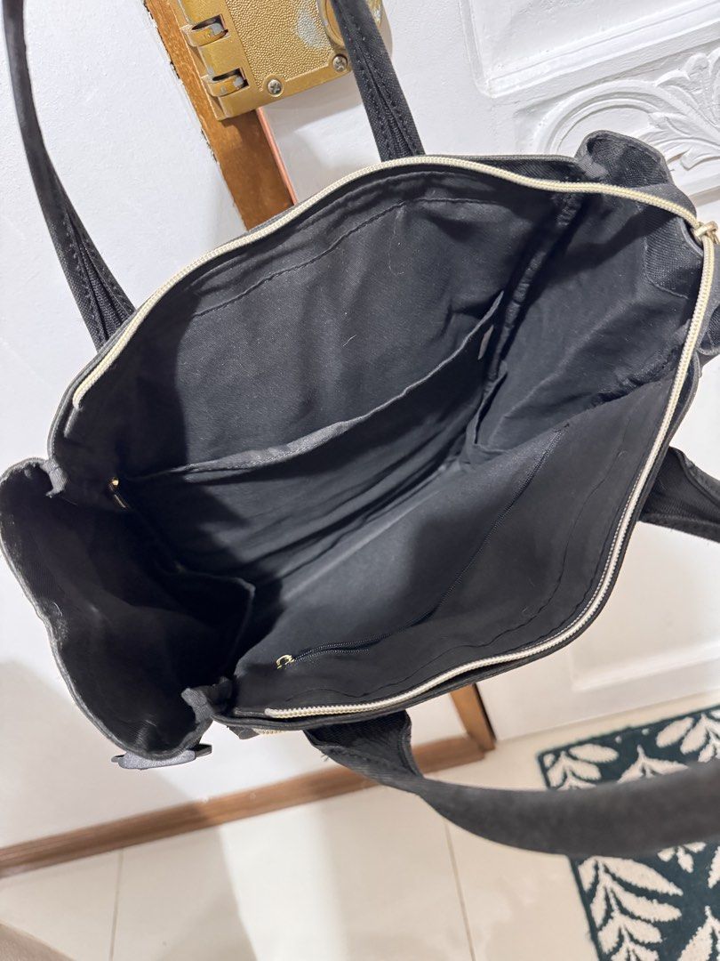 Anello Black Convertible Tote Backpack (Category: Backpacks) located in Muntinlupa City. Submitted by mimitatsboutique (Listing ID 1464824552, Image 3). Description: - Anello convertible tote backpack in black canvas. - Versatile design works as a handbag or a backpack with adjustable straps. - Plenty of exterior and interior pockets to keep things organized. - Gold-tone zippers and hardware throughout. - Side water bottle pockets and a secure fr