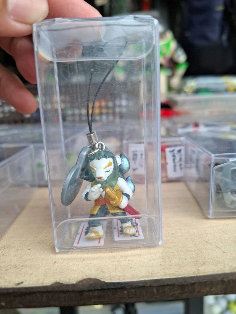 Anime Character Strap Figurine Keychain Phone Charm (Category: Character Goods) located in Manila. Submitted by rocksolid227 (Listing ID 1464822936, Image 1). Description: - Cute blue-haired anime character with sword figurine - Attached to a black strap with a secure silver clasp - Includes a stylish grey coin-like accessory - Comes inside a clear protective display case - Ideal for anime fans and merchandise collectors.