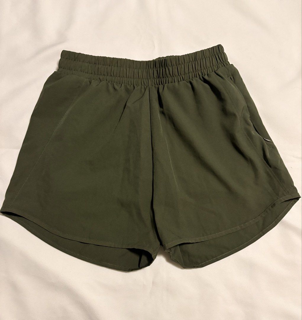 Anko Active Olive Green Running Shorts Size 8 (Category: Activewear) located in Mandaluyong City. Submitted by sarisaringtinda (Listing ID 1464930366, Image 1). Description: Olive green running shorts from Anko Active. Elastic waistband, comfortable stretchy fit. Built-in liner shorts underneath for extra coverage. Small hidden zip pocket on the side. Curved hem design on the legs. Size 8 tag attached inside. Great piece for workouts, gym session