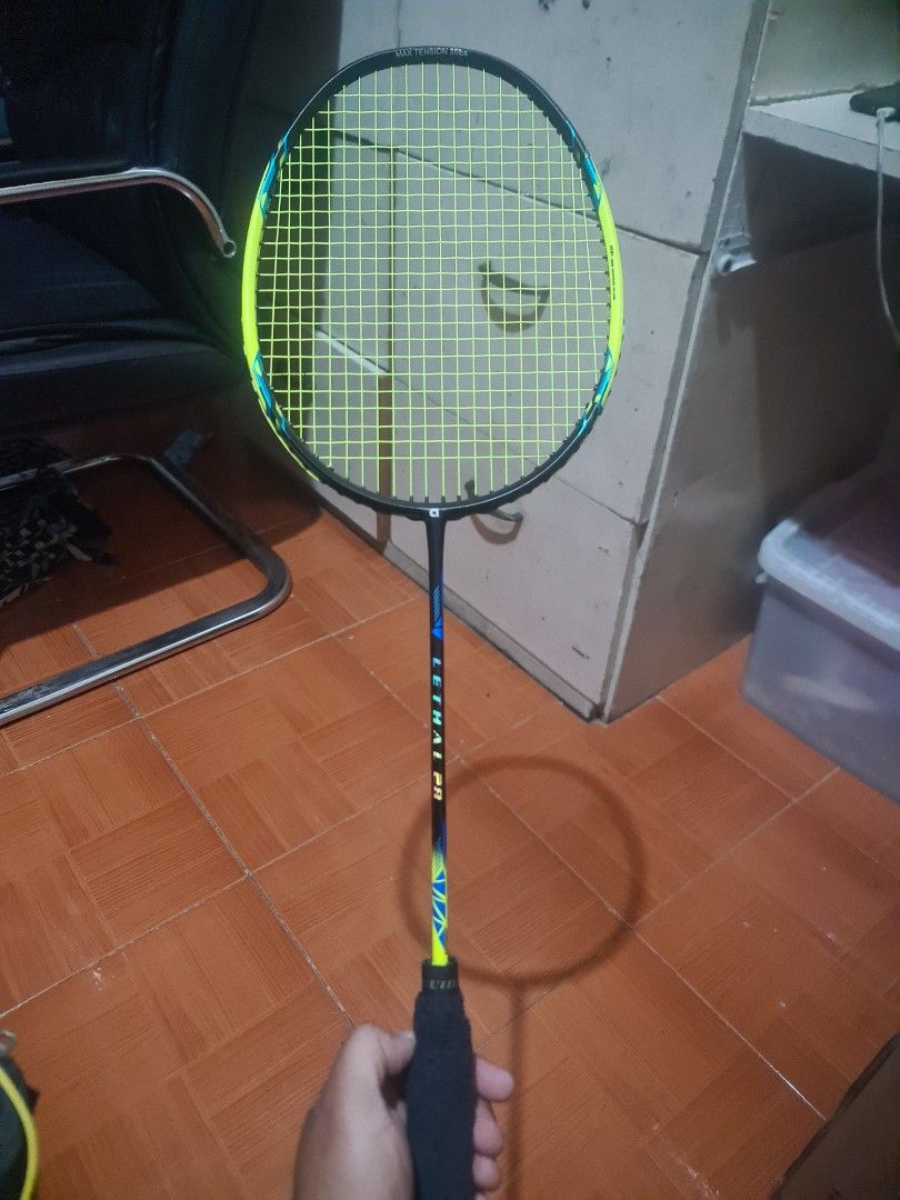 Apacs Lethal 28 Badminton Racket (Category: Racket and Ball Sports) located in Manila. Submitted by josejhayco69373 (Listing ID 1464868905, Image 1). Description: - Model: Apacs Lethal 28 Badminton Racket - Performance: Excellent power and durability, perfect for intermediate to advanced players - Strings: Neon yellow string with a maximum tension of 35lbs - Grip: Black grip tape newly wrapped on the handle - Inclusion: Matching black Apacs zip c