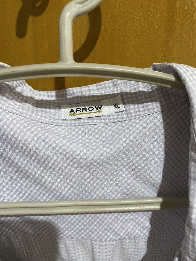 Arrow Gingham Check Shirt Light Purple XL (Category: Tshirts & Polo Shirts ) located in Antipolo. Submitted by jl_2025 (Listing ID 1464874188, Image 1). Description: - Brand: Arrow - Color/Pattern: Light purple gingham check - Size: XL - Fit: Standard fit - Details: Collared, button-down front, two chest pockets - Fabric: Lightweight and breathable - Condition: Good overall - Style: Casual everyday wear Rfs: moving out Location: Antipolo.