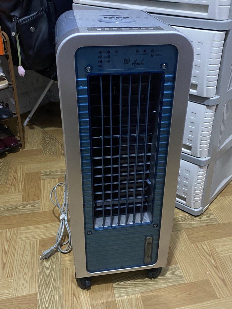 Asahi IC-009 Air Cooler (Category: Air Conditioning and Heating) located in Quezon City. Submitted by 4riazuki (Listing ID 1464864373, Image 1). Description: - Brand/Model: Asahi Air Cooler IC-009 - Color: Stylish grey and blue - Features: Top and front control panels, oscillation, multiple modes, timer, ionizer, and cooling function - Convenience: Equipped with bottom wheels for easy mobility, a top-opening water compartment, and a fully opening