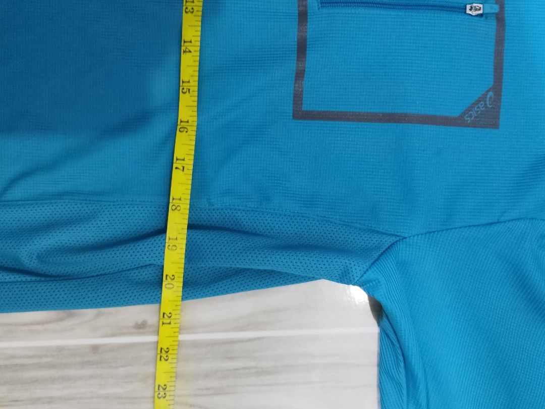 Asics Blue Polo Shirt Size 105 (Category: Tshirts & Polo Shirts ) located in Caloocan City. Submitted by moneyhunt25 (Listing ID 1464854261, Image 3). Description: - Brand: Asics - Color: Blue - Size: 105 (Tag inside) - Design: Short-sleeve polo with front zip collar and chest pocket - Material: Breathable athletic fabric - Condition: Good option for workouts or casual wear.