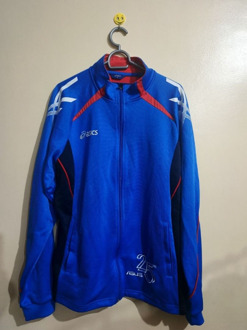 Asics Vintage Athletic Track Jacket (Category: Coats, Jackets and Outerwear) located in Taguig. Submitted by wenwen_21 (Listing ID 1464925873, Image 1). Description: Vintage Asics zip-up athletic track jacket in bold royal blue with red and navy accents. Features the embroidered Asics logo on the chest, printed stripe graphics along the shoulders, and custom branding near the lower hem. Style: Full-Zip Track Jacket / Sportswear Color: Royal Blue 
