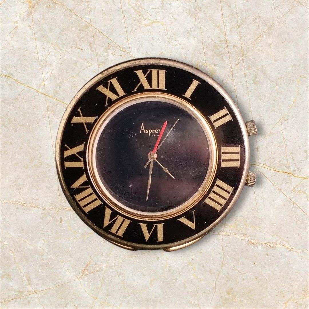 Asprey Luxury Desk Clock (Category: Vintage Collectibles) located in San Juan City. Submitted by exclusivelyours (Listing ID 1464925688, Image 1). Description: Asprey is a high-end British luxury retailer ("Jewelers to the Royal Family"), known for rebadging or commissioning timepieces from top Swiss manufacturers. ​Design Rarity: While luxury travel clocks from the late 20th century (1970s–1990s) are relatively easy to find, this specific bezel 