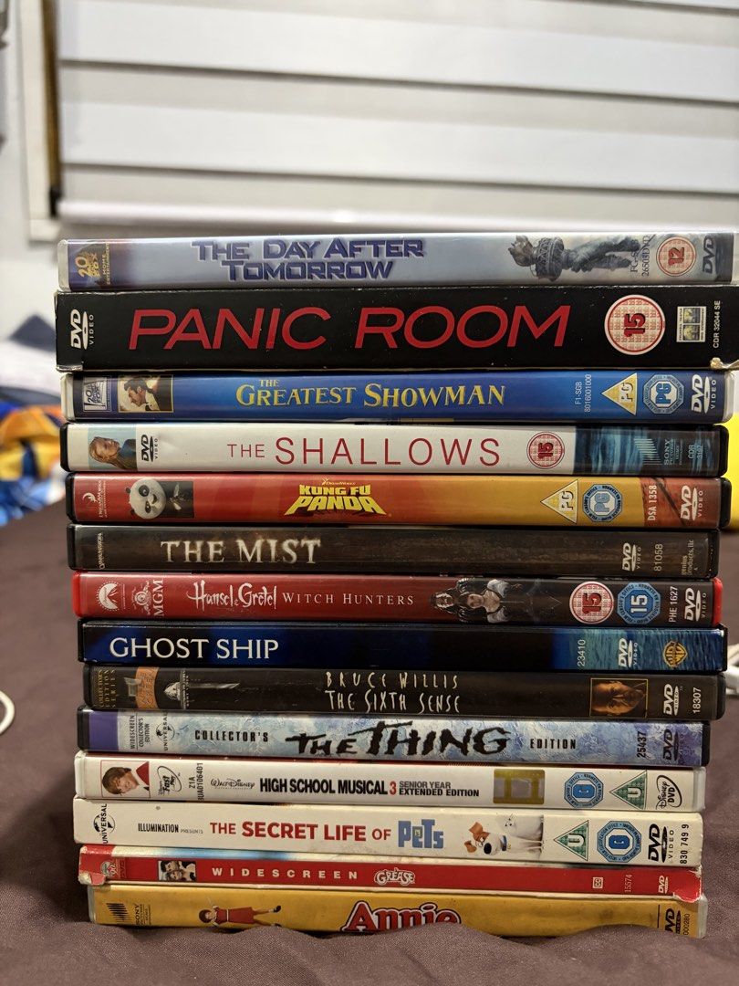 TAKE ALL! All original! Mix regions (Category: CDs & DVDs) located in Caloocan City. Submitted by gamegirl97 (Listing ID 1464835762, Image 1). Description: - Bundle of 14 assorted movie DVDs with original cases - Includes hit titles: The Day After Tomorrow, Panic Room, The Greatest Showman, The Shallows, Kung Fu Panda, The Mist, Hansel & Gretel Witch Hunters, Ghost Ship, The Sixth Sense, The Thing, High School Musical 3, The Secret Life of Pets, 
