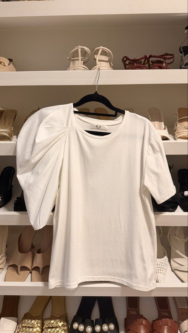 Asymmetrical Puff Sleeve White Tee (Category: Shirts) located in Quezon City. Submitted by closetcleanupfairy (Listing ID 1464830428, Image 3). Description: Bought in Bangkok.