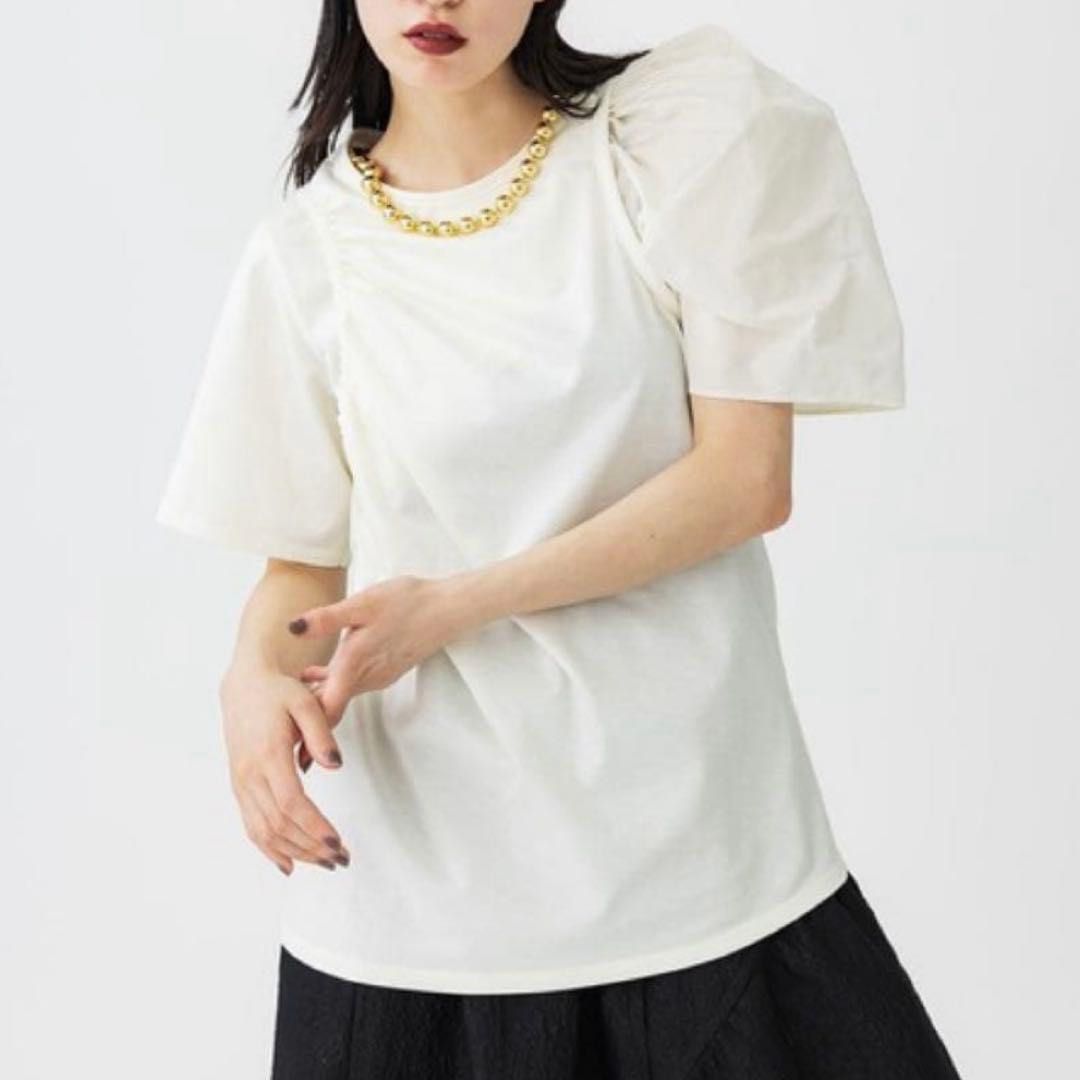 Asymmetrical Puff Sleeve White Tee (Category: Shirts) located in Quezon City. Submitted by closetcleanupfairy (Listing ID 1464830428, Image 1). Description: Bought in Bangkok.