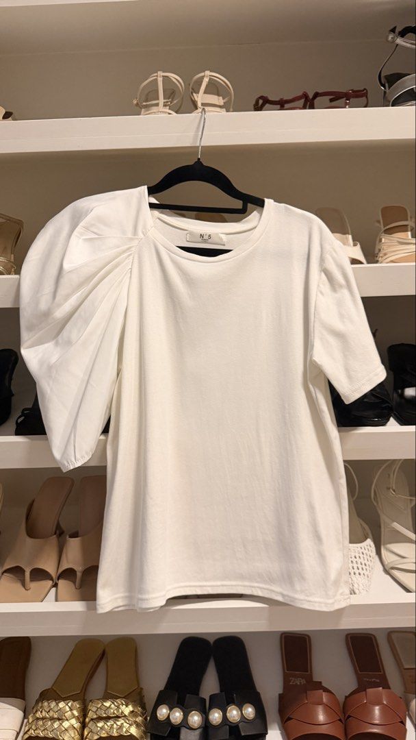 Asymmetrical Puff Sleeve White Tee (Category: Shirts) located in Quezon City. Submitted by closetcleanupfairy (Listing ID 1464830428, Image 2). Description: Bought in Bangkok.