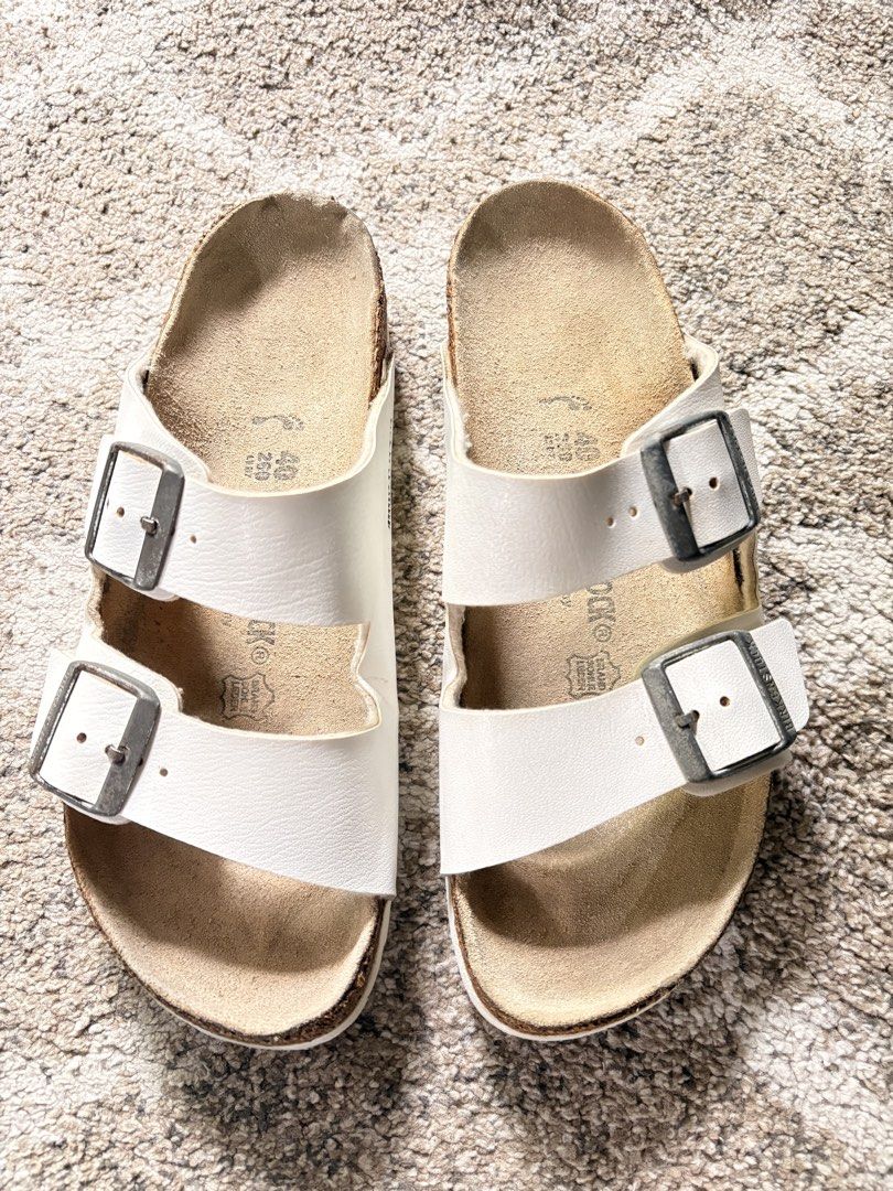 Auth Preloved Birkenstock Arizona (Category: Slippers and slides) located in Paranaque City. Submitted by silentstone.dolphin (Listing ID 1464773857, Image 1). Description: White Color.. Brass Buckle.. Visible Print.. Size 40N-39R.. Clean&Ready to Wear✅ Super Nice in Actual😍.