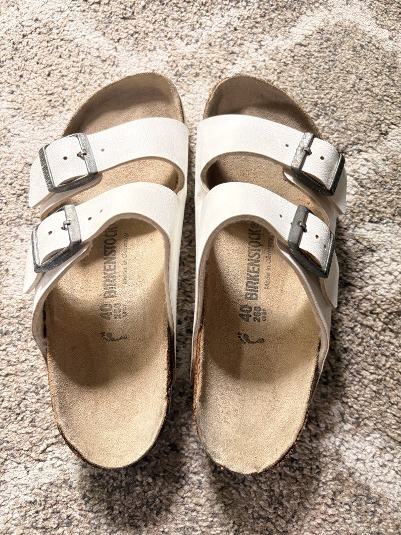 Auth Preloved Birkenstock Arizona (Category: Slippers and slides) located in Paranaque City. Submitted by silentstone.dolphin (Listing ID 1464773857, Image 2). Description: White Color.. Brass Buckle.. Visible Print.. Size 40N-39R.. Clean&Ready to Wear✅ Super Nice in Actual😍.