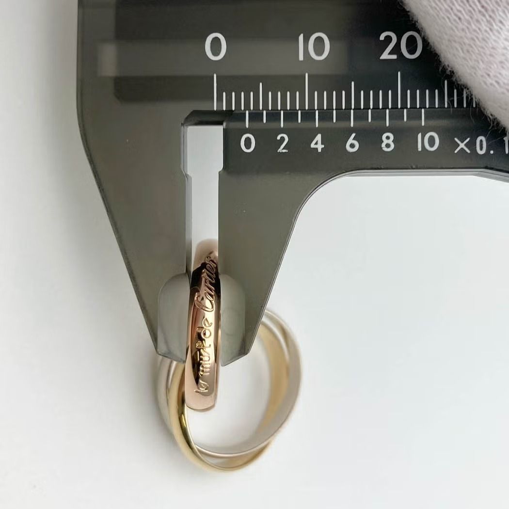 Authentic Cartier Trinity Ring #54 (Size 14) 750 WG YG PG (Category: Rings) located in General Trias. Submitted by japan_secondhand_products (Listing ID 1464878754, Image 3). Description: Product Rank A color 3 gold material 750 WG×YG×PG size Weight: 7.8g specification Size: #54 gauge Actual size: Size 14 Ring width: Approximately 0.35cm accessories None (A service case will be included) *Only the items listed are included. Product condition Main
