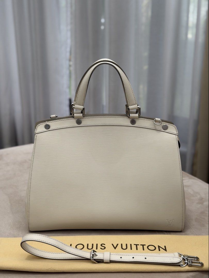 Authentic Louis Vuitton Epi Brea MM size (Category: Tote Bags) located in Manila. Submitted by maria_2326 (Listing ID 1464945912, Image 1). Description: Louis Vuitton Epi Brea MM size Tote 💯% Authentic W/ dust bag and long strap only No lowballing! Location: Manila/QC.