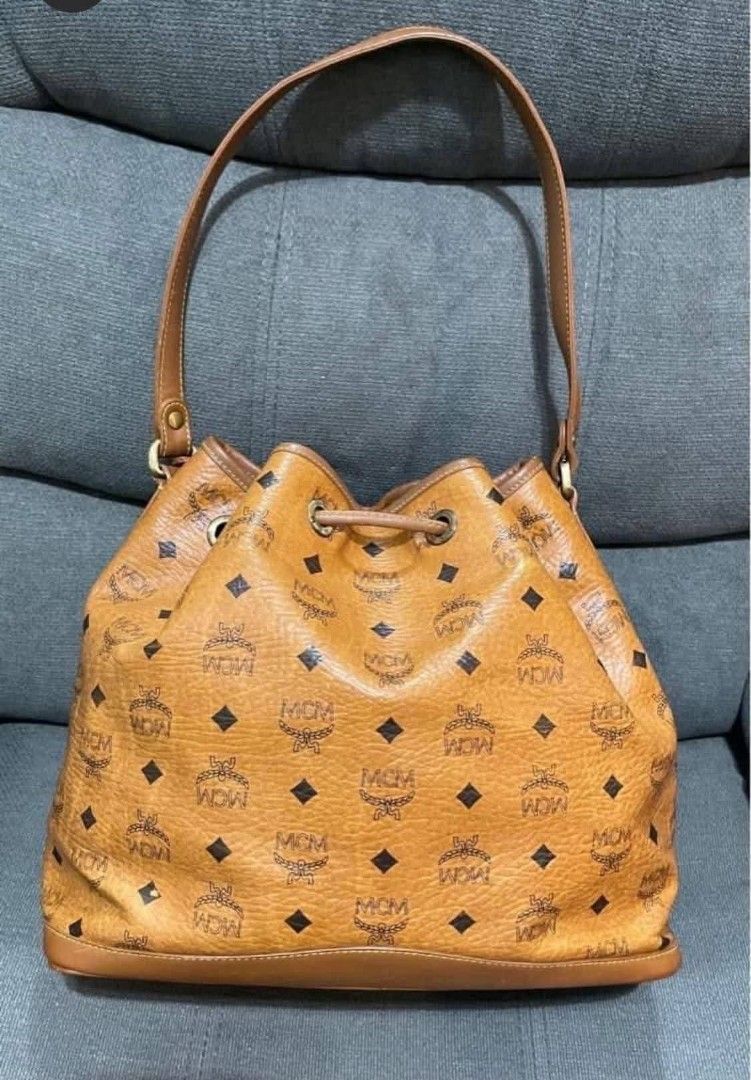 Authentic MCM Cognac Bucket (Category: Shoulder Bags) located in Quezon City. Submitted by luxxechic (Listing ID 1464785558, Image 3). Description: with white tag ykk zip turnable screw pure leather no issue actual photo poated mop: gcash.