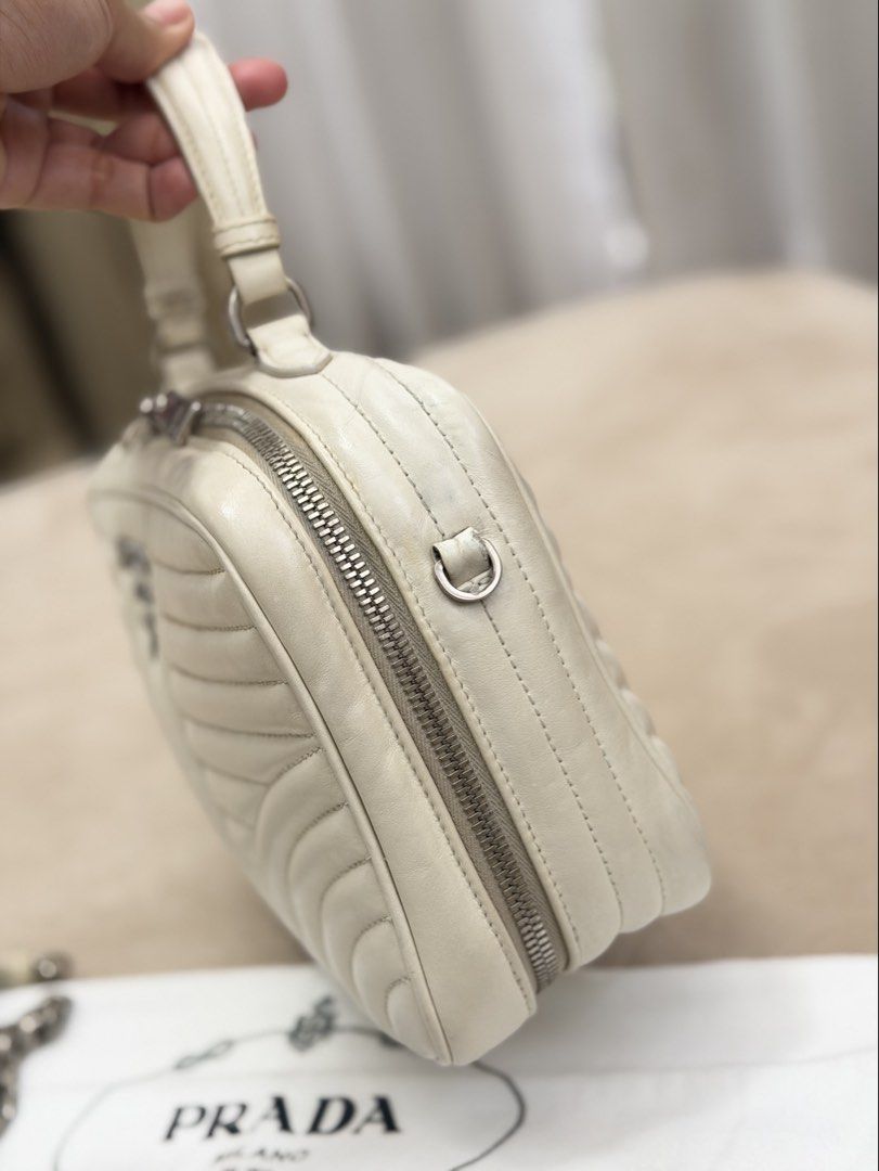 Authentic Prada Soft Calfskin Diagramme Camera Bag (Category: Cross-body Bags) located in Manila. Submitted by maria_2326 (Listing ID 1464944313, Image 3). Description: Prada Soft Calfskin Diagramme Camera Bag | 💯% Authentic W/ dust bag and chain sling only Flaw: dirt/stain on body, signs of wear Please see detailed photos No lowballing! Location: Manila/QC.