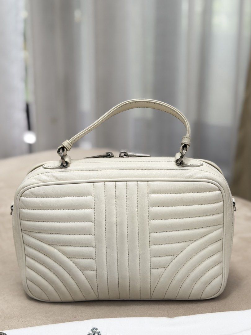 Authentic Prada Soft Calfskin Diagramme Camera Bag (Category: Cross-body Bags) located in Manila. Submitted by maria_2326 (Listing ID 1464944313, Image 2). Description: Prada Soft Calfskin Diagramme Camera Bag | 💯% Authentic W/ dust bag and chain sling only Flaw: dirt/stain on body, signs of wear Please see detailed photos No lowballing! Location: Manila/QC.