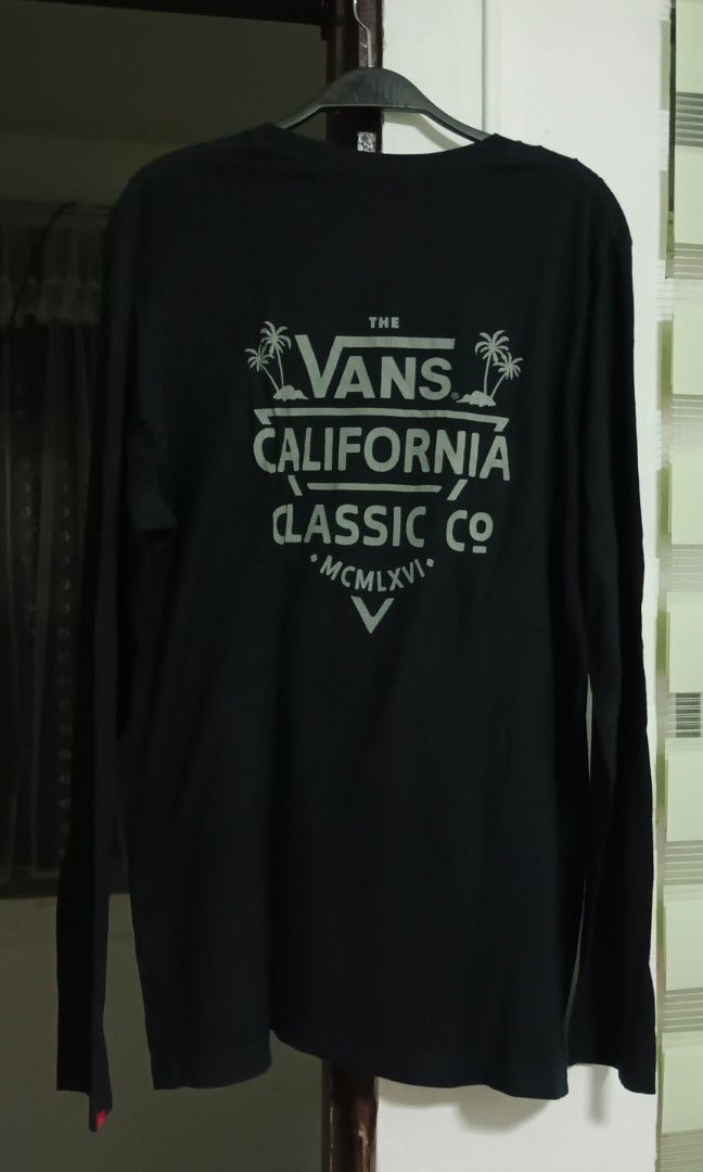 Authentic Vans California Long Sleeve (Size L) (Category: Tshirts & Polo Shirts ) located in Calamba. Submitted by gneapsektor (Listing ID 1464913052, Image 2). Description: 100% Original Vans Apparel (US Thrift) Design: California Classic design with large backprint (backhit). Size: Men's Large (L) Condition: 9/10. Fresh fabric, deep black color, no holes. Minor natural print fade for vintage look. Authenticity: Printed neck tag (RN# 96277) + or