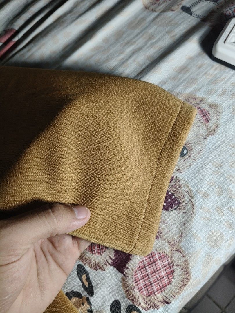 Autumn Unisex Light Brown Open Blazer (Category: Coats, Jackets and Outerwear) located in Lapu Lapu. Submitted by hooman422 (Listing ID 1464916439, Image 3). Description: • Style: Longline open-front duster blazer or lightweight trench coat. • Color: Warm mustard yellow / camel brown tone. • Neckline: Notched lapel collar. • Sleeves: Full-length, straight long sleeves. • Pockets: Two large, rectangular patch pockets on the front. • Fit: Relaxed, 