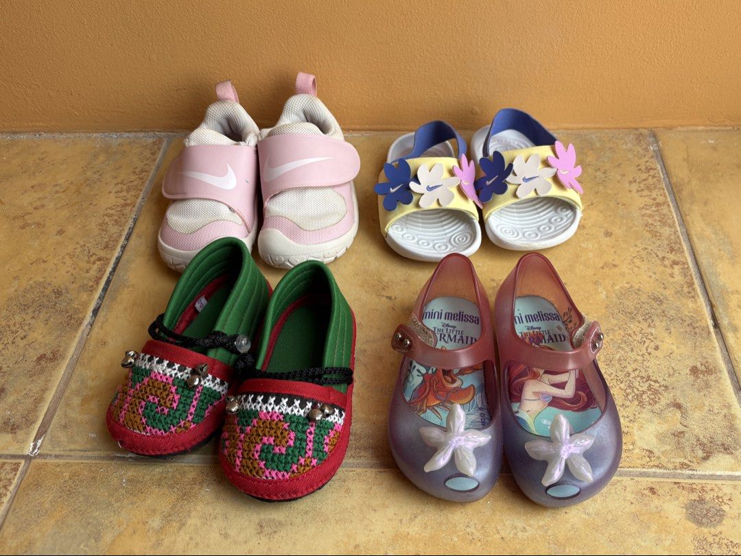 Baby Shoes Bundle - Nike, Mini Melissa & More (Category: Babies & Kids Fashion) located in Silang. Submitted by aoao87 (Listing ID 1464780174, Image 2). Description: 12 to 24 months baby girl shoes bundle NOT SOLD SEPARATELY. Take all only. 1500 for 4 Size: all 6c us, 5.5 uk, 22eu, 12cm 1 Nike Swoosh 1 Essential pink (with stain, see photo) 1 Nike Kawa SE white with flowers (excellent condition) 1 traditional thai slippers with bell (excellent co