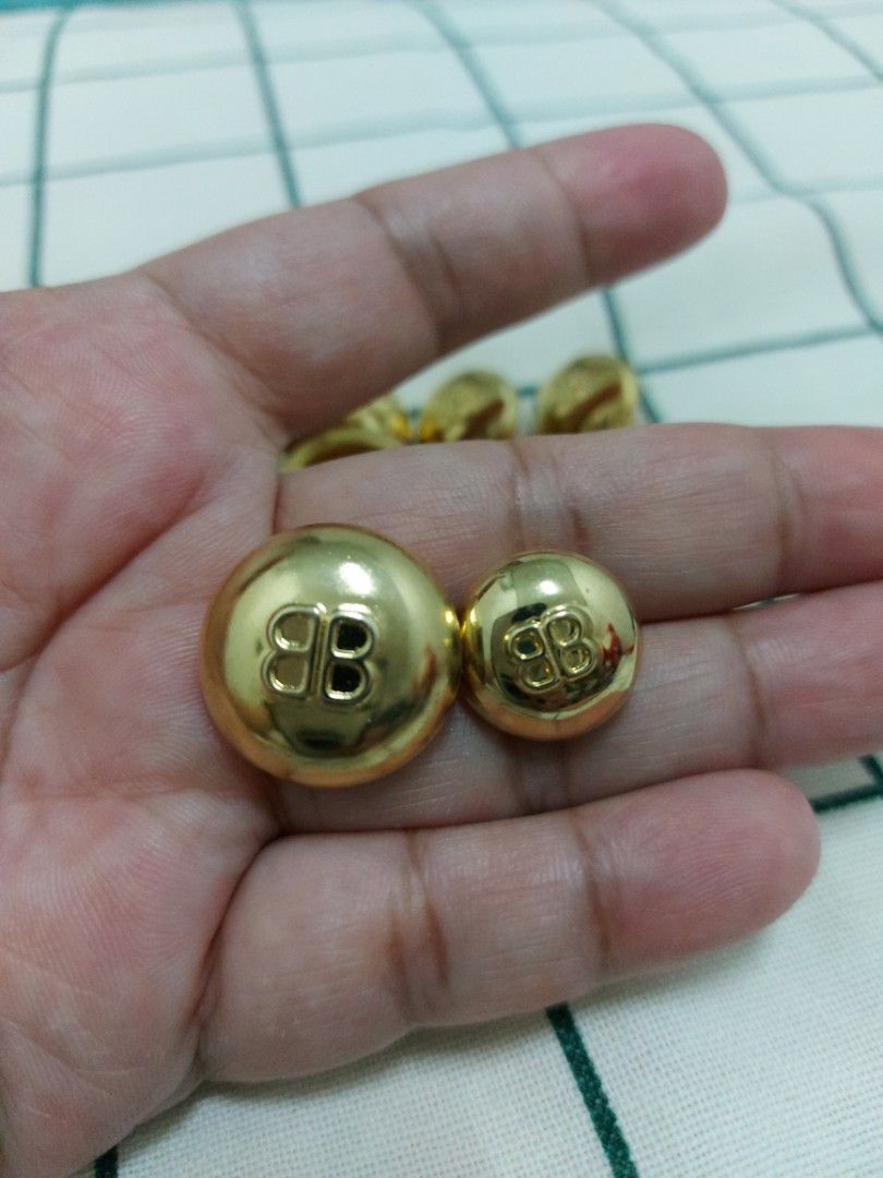 BALENCIAGA buttons gold tone with BB logo (Category: Blouses) located in Quezon City. Submitted by threetwotwo2ndaccount (Listing ID 1464780123, Image 3). Description: Balenciaga button with BB logo gold tone 4pcs big 5pcs small untarnish.