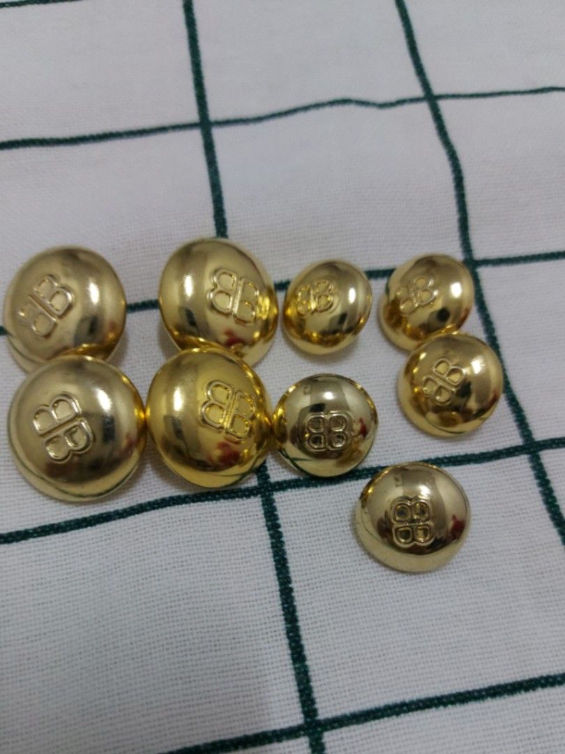 BALENCIAGA buttons gold tone with BB logo (Category: Blouses) located in Quezon City. Submitted by threetwotwo2ndaccount (Listing ID 1464780123, Image 1). Description: Balenciaga button with BB logo gold tone 4pcs big 5pcs small untarnish.