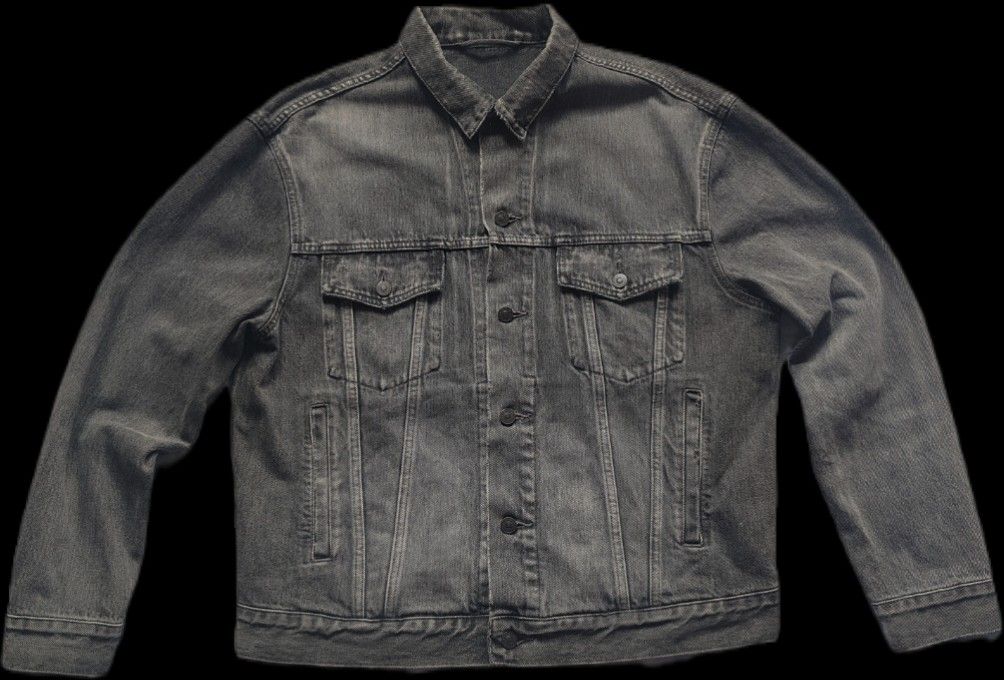 Balenciaga Logo Printed Denim Jacket (Category: Luxury Apparel) located in Kalibo. Submitted by kerrokerropii (Listing ID 1464892876, Image 1). Description: Balenciaga grey washed denim jacket. Classic trucker style with button closure and front pockets. Large Balenciaga lettering printed across the upper back panel. Heavy cotton fabric with intentional vintage distressing throughout. Structured fit with adjustable waist tabs at the hem..