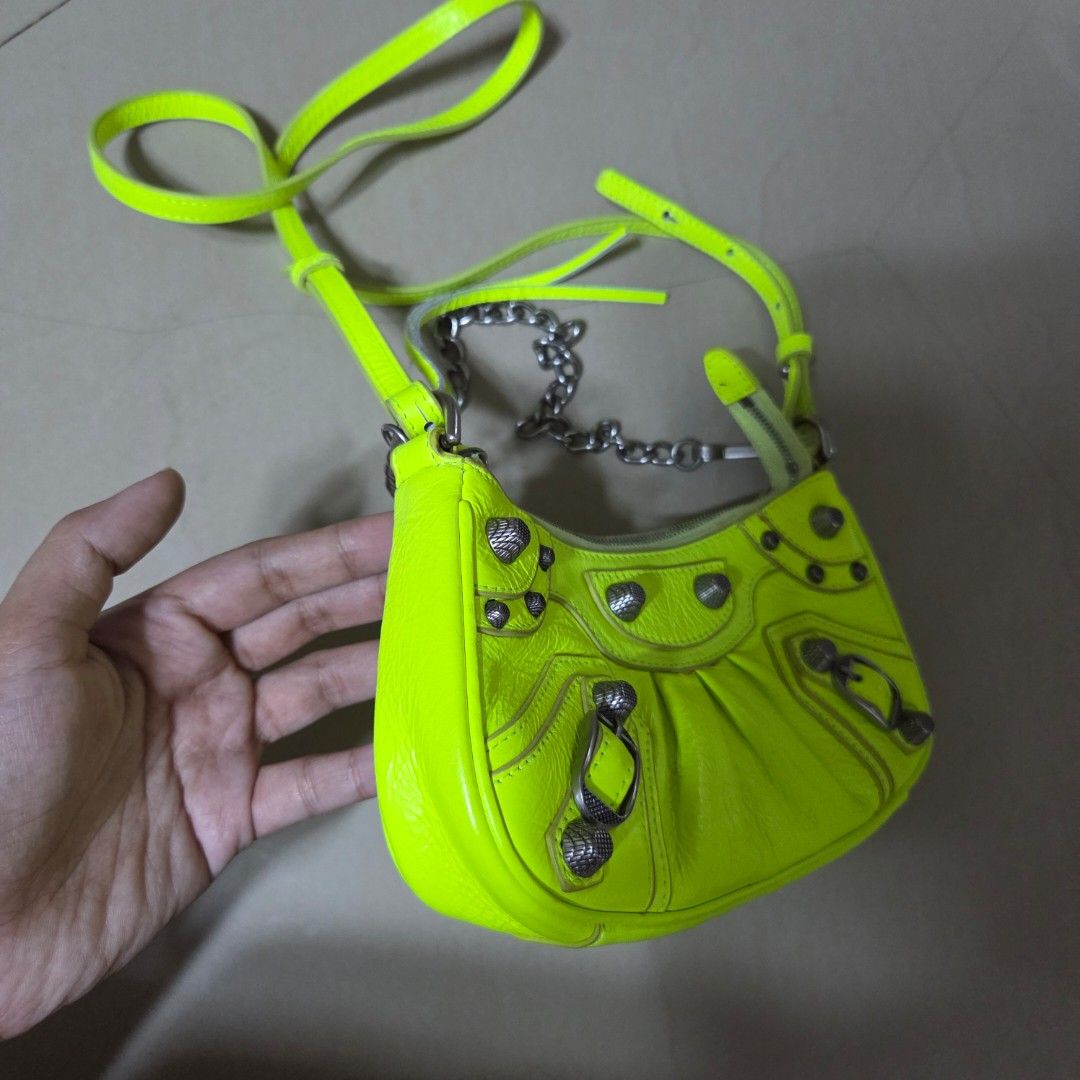 Balenciaga Neon Yellow Le Cagole MINI (Category: Shoulder Bags) located in San Mateo. Submitted by liezelsells (Listing ID 1464779873, Image 2). Description: Balenciaga Le Cagole MINI Neon Yellow, Coded. BB Underzip. With Dust Bag Issue/s: May Minimal Dirt/Glue Residue. Location: San Mateo, Rizal MOP: GCash. NO COD. Couriers: Lalamove, J&T, LBC, JRS. NO Return, Exchange, Refund. .
