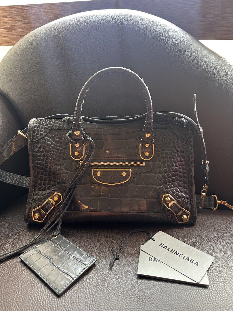 Balenciaga Small City Croc embossed (Category: Luxury Bags & Wallets) located in Manila. Submitted by bduchess (Listing ID 1464801836, Image 1). Description: Balenciaga Metallic Edge Croc embossed Small comes with dustbag, cards, strap and mirror. In good well loved condition. With Legitgrails authentication Slightly nego. Low ballers will be ignored.