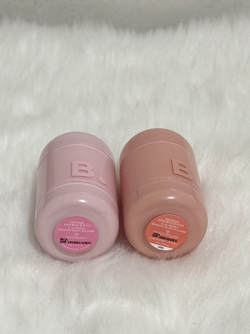 BANILA Co Romantic Blush Lip & Cheek Set (Category: Makeup) located in Manila. Submitted by krystel.bk (Listing ID 1464771543, Image 3). Description: - Brand: Banila Co - Item: Romantic Blush Lip & Cheek - Shades included: 01 Dear Bunny and 12 Peach Mousse - Condition: Swatched only - Net Weight: 3.7g each - Formula: Creamy multi-use for lips and cheeks - Packaging: Cute, compact capsule design ideal for daily touch-ups - Expiry dates clearly pri