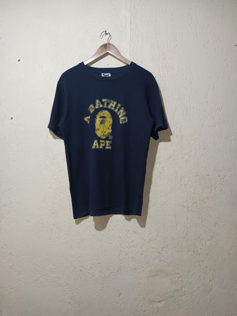 Bape College tee (Category: Activewear) located in San Pablo. Submitted by thriftyjd (Listing ID 1464872994, Image 1). Description: Dimes: L27 x W21 Condition/color rate: 9/10 No Issue.