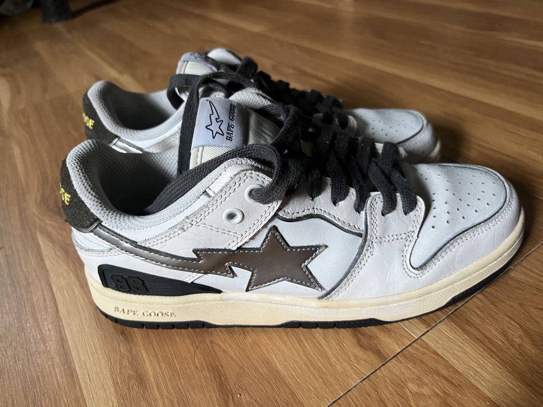 Bape Goose Bapesta Shoes (Category: Sneakers) located in Manila. Submitted by shanaaa.collects (Listing ID 1464838580, Image 3). Description: - Model: Bape Goose sneakers - Colorway: Grey and white with black laces - Design: Star logo on side panel and tongue tag, textured heel overlay with embroidered text - Comfort: Thick padded collar - Sole: Rubber outsole with tread pattern - Condition: Clean uppers, minor wear on soles.
