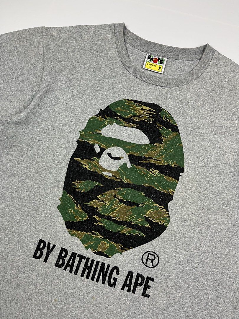 Bape Head Tiger Camo By Bathing Ape Tee (Category: Tshirts & Polo Shirts ) located in Puerto Princesa. Submitted by paradise5300 (Listing ID 1464923187, Image 3). Description: Bape Head Tiger Camo By Bathing Ape Tee Tagged Size: Medium Dimensions Inches length: 26 Inches width: 21 Condition: Very good Color rate: 9.5 Flaws: Hairline cracks & light stain (removable) 1,799 shipping fee is not yet included. .