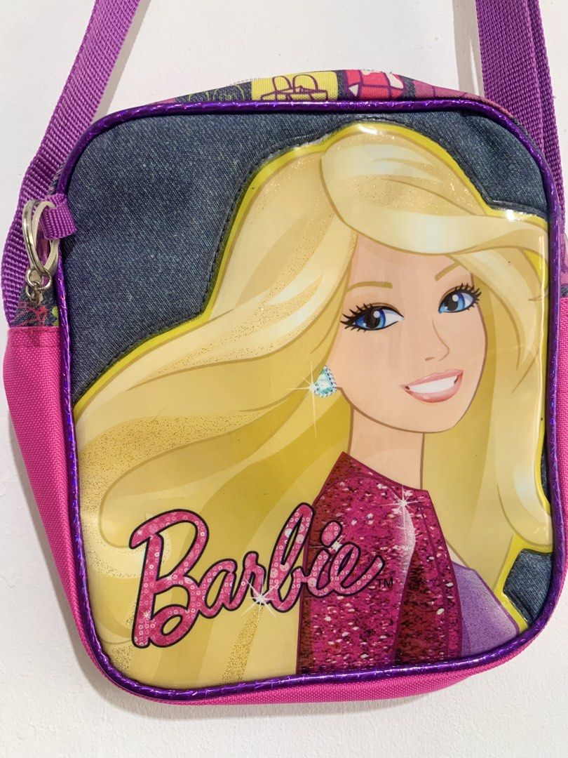 Barbie Pink / Purple Crossbody Shoulder Bag (Category: Babies & Kids Fashion) located in San Pedro. Submitted by kcshops (Listing ID 1464796940, Image 3). Description: Barbie Crossbody / Shoulder Bag 💰 Price: ₱400 - Negotiable ✨ Condition: Pre-loved, good condition 📍 Location: San Pedro, Laguna 🤝 Meet-up: Southwoods Mall, Biñan City 🚚 Delivery: J&T or Lalamove — delivery fee shouldered by buyer 📩 Message me for additional photos, measurement
