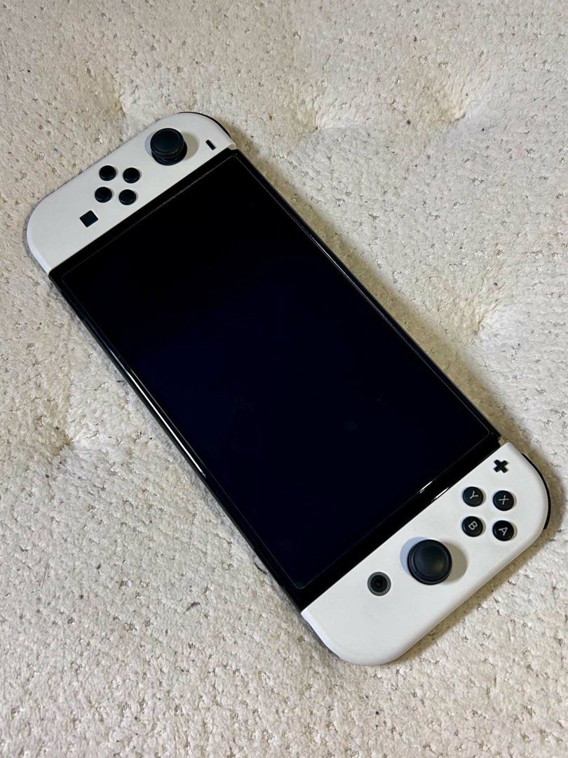 [BARELY USED] Nintendo Switch OLED (Category: Nintendo) located in General Trias. Submitted by dallianna81777 (Listing ID 1464888460, Image 3). Description: ‼️FOR SALE ‼️ ‼️ NINTENDO SWITCH OLED (NON JAILBREAK)‼️ Price: ₱16,499 ✨10/10 Physical Condition! Good as brand new ✨ Perfect for personal use / Gift Inclusions: 📦 Nintendo switch Oled 📦 Original Joy cons L/R 📦 Original Charger 📦 Original Box 📦 Original grip 📦 Original Straps 📦 Origina