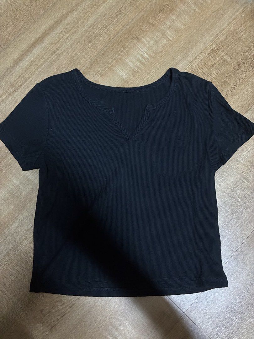 Basic basic Black Ribbed semi Crop Top with V-Neck Detail (Category: Shirts) located in Quezon City. Submitted by habits.mnl (Listing ID 1464850854, Image 1). Description: Large on tag fits medium - Color: Black - Style: Short-sleeve crop top with V-notch neckline - Material: Soft, stretchy ribbed knit - Versatility: Easy to match with high-waist jeans, shorts, or skirts - Condition: Excellent, no stains or loose threads.