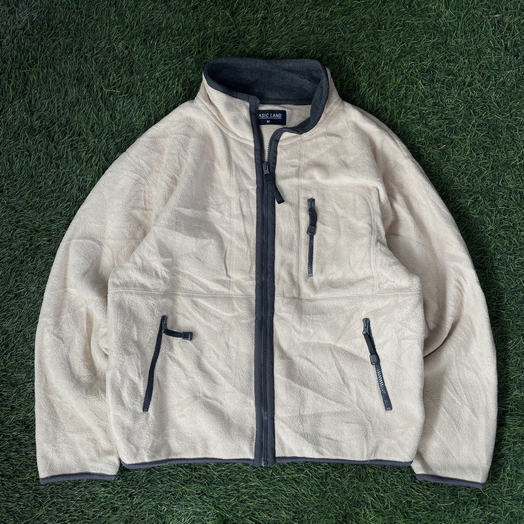 Basic Land Full-Zip Fleece Jacket (Category: Coats, Jackets and Outerwear) located in Pasig City. Submitted by icie_finds (Listing ID 1464864577, Image 1). Description: Basic Land Full-Zip Fleece Jacket SIZE: Fits Large (Tagged Medium) DIMES: W 22.5 L 24 Model: Basic Land Full-Zip Outdoor Fleece Jacket Style: Cozy outdoor zip-up fleece featuring a soft cream/off-white body, dark contrast trim details, high mock neck collar, chest pocket, and secu