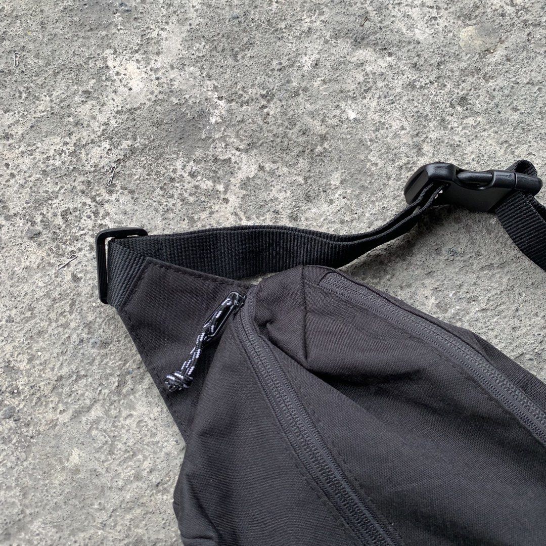 Beams Heart Black Waist Bag (Category: Belt bags, Clutches and Pouches) located in Polangui. Submitted by b0ssl00ts (Listing ID 1464807091, Image 3). Description: - Brand: Beams Heart - Material: Sturdy black canvas with white embroidered branding - Storage: Main compartment with a handy diagonal zip pocket - Hardware: Smooth zippers with stylish black and white speckled cord pulls - Fit: Adjustable black strap with a secure plastic buckle closur