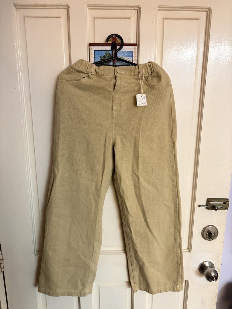 Beige Gartered Waist Wide Leg Pants (Category: Jeans) located in Dasmarinas. Submitted by fionaornopia (Listing ID 1464890394, Image 1). Description: FREE SHIPPING🚚 ⭐️ Style: Wide leg fit with neutral beige color ⭐️Condition: Brand new / Never used ⭐️ Size: 21-28 ⭐️ length: 35 inches - Waistband: Stretchy elastic at the back with front button closure - Pockets: Two functional front pockets and two back pockets - Versatility: Easy to match with b