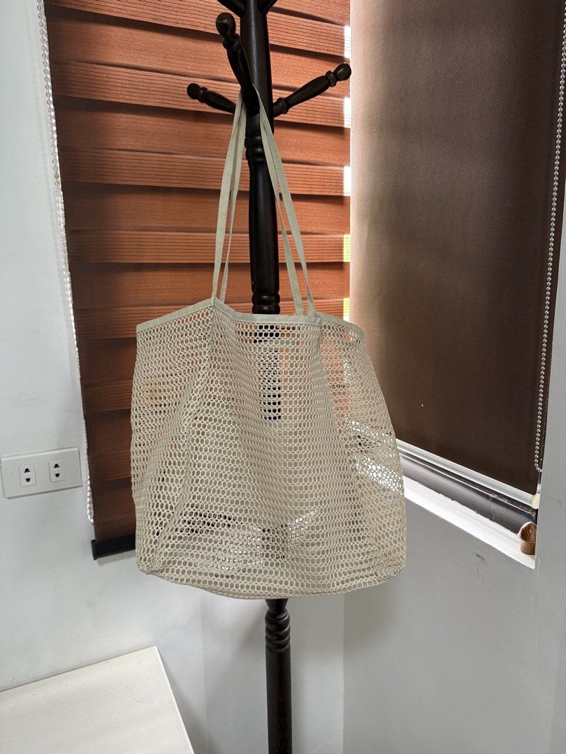 Beige Mesh Beach Tote Bag Shopper Handbag (Category: Tote Bags) located in Imus. Submitted by neirasalonga_ (Listing ID 1464790423, Image 1). Description: FREE if you buy at least ₱1,500 worth of my listing. RFS: Decluttering 📍Imus, Cavite DELIVERY: via lalamove/grab. delivery fee shouldered by buyer..
